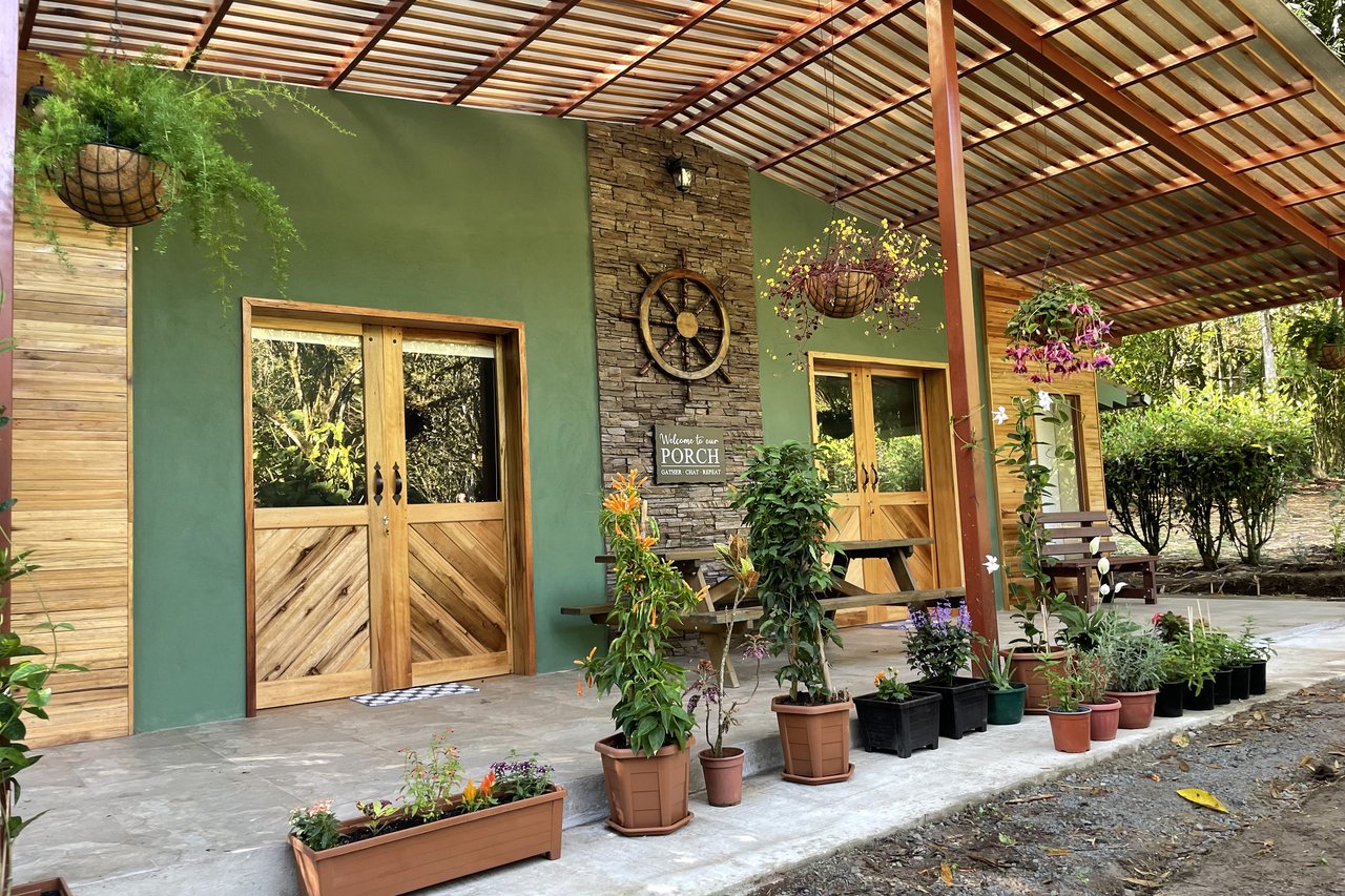 The cabin, tucked into the green